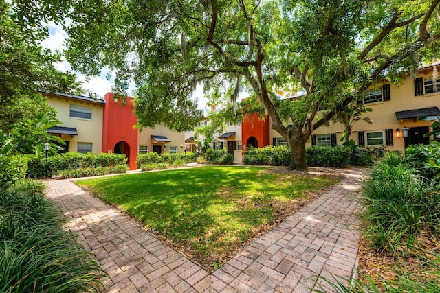 surrounding community with a lawn