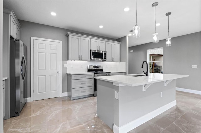 3 Orange Blossom Dr, Eustis, FL 32726 - kitchen featuring marble finish floor, stainless steel appliances, light countertops, a sink, and baseboards