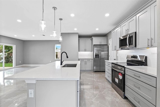 3 Orange Blossom Dr, Eustis, FL 32726 - kitchen featuring stainless steel appliances, a kitchen island with sink, a sink, recessed lighting, and marble finish floor