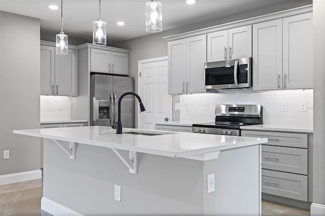 3 Orange Blossom Dr, Eustis, FL 32726 - kitchen featuring tasteful backsplash, baseboards, stainless steel appliances, and a kitchen island with sink