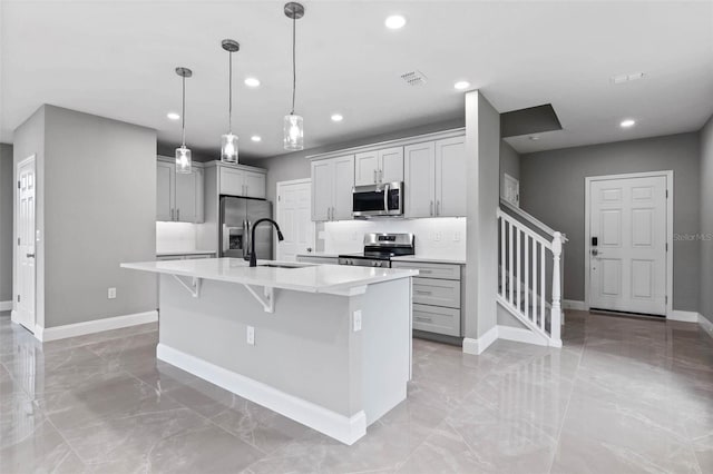 3 Orange Blossom Dr, Eustis, FL 32726 - kitchen with stainless steel appliances, a sink, recessed lighting, marble finish floor, and light countertops