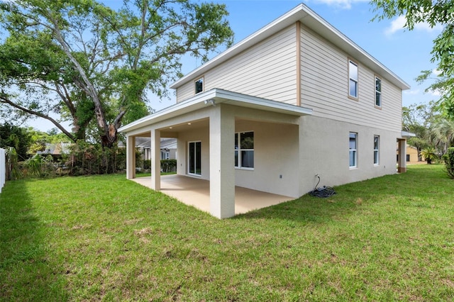 3 Orange Blossom Dr, Eustis, FL 32726 - rear view of house with a yard, a patio area, and stucco siding