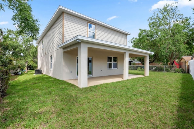 3 Orange Blossom Dr, Eustis, FL 32726 - back of property with fence, central AC, stucco siding, a patio area, and a lawn