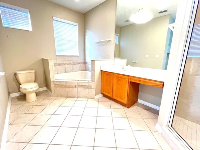 9046 Tuscan Valley Pl, Orlando, FL 32825 - full bath with toilet, tile patterned floors, a garden tub, and visible vents