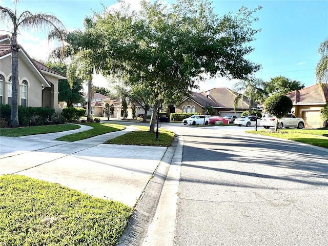 9046 Tuscan Valley Pl, Orlando, FL 32825 - view of road with a residential view