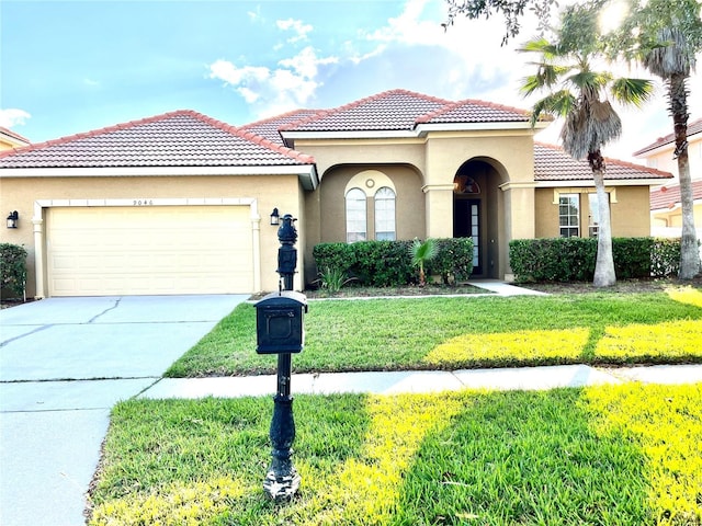 9046 Tuscan Valley Pl, Orlando, FL 32825 - mediterranean / spanish-style home featuring concrete driveway, stucco siding, an attached garage, a front yard, and a tiled roof