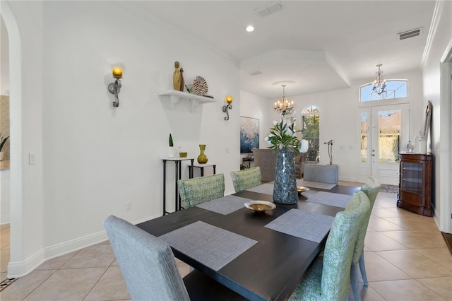 dining room featuring arched walkways, visible vents, a notable chandelier, and light tile patterned floors