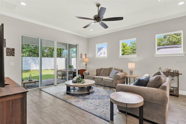 1821 Simonton Ave, Orlando, FL 32806 - living area with recessed lighting, plenty of natural light, light wood-style flooring, and ceiling fan