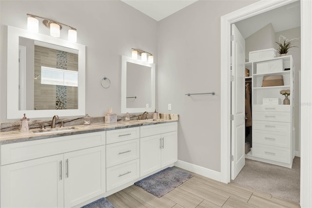 1821 Simonton Ave, Orlando, FL 32806 - full bathroom featuring tiled shower, double vanity, baseboards, and a sink