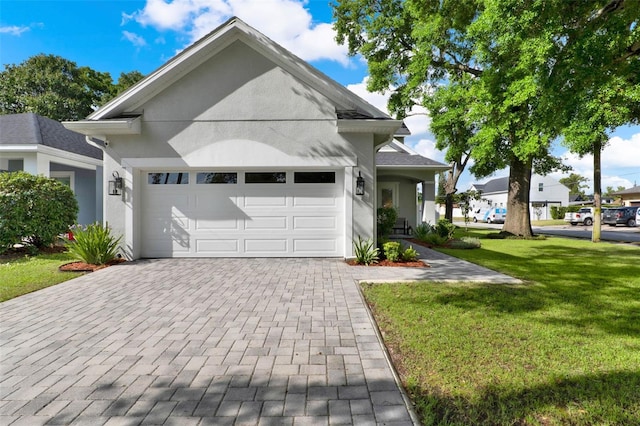 1821 Simonton Ave, Orlando, FL 32806 - view of front of home with a front yard, an attached garage, decorative driveway, and stucco siding