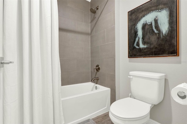 1821 Simonton Ave, Orlando, FL 32806 - full bathroom featuring toilet, shower / bath combo with shower curtain, and wood finished floors