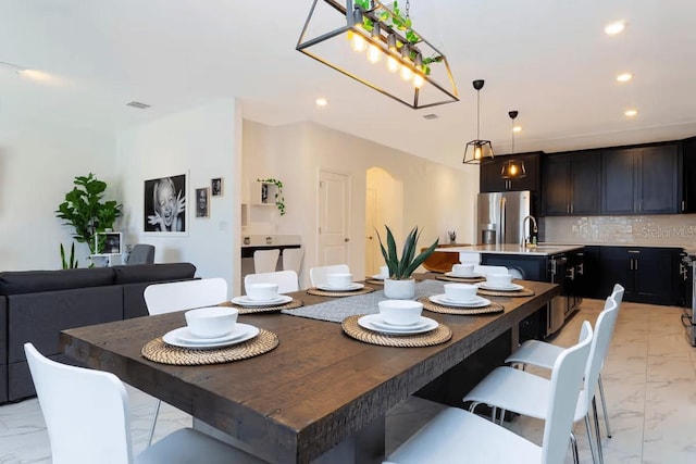 1013 Leader St, Davenport, FL 33896 - dining space with visible vents, recessed lighting, and marble finish floor