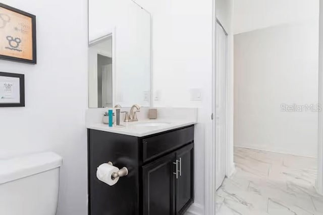 1013 Leader St, Davenport, FL 33896 - bathroom featuring toilet, marble finish floor, and vanity