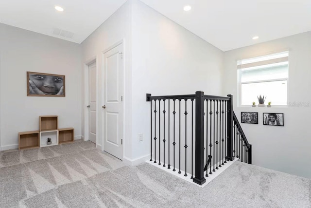 1013 Leader St, Davenport, FL 33896 - hall with carpet flooring, baseboards, an upstairs landing, and recessed lighting
