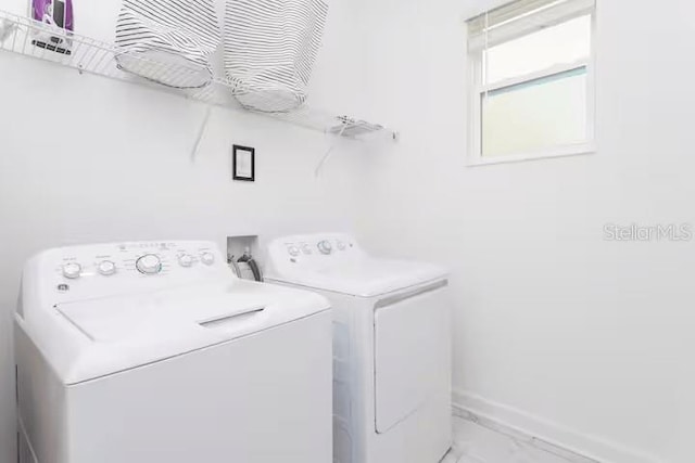 1013 Leader St, Davenport, FL 33896 - washroom with independent washer and dryer, marble finish floor, laundry area, and baseboards