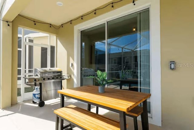 1013 Leader St, Davenport, FL 33896 - balcony with grilling area, a patio, and a sunroom