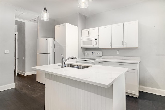 kitchen featuring baseboards, a sink, white cabinets, and white appliances