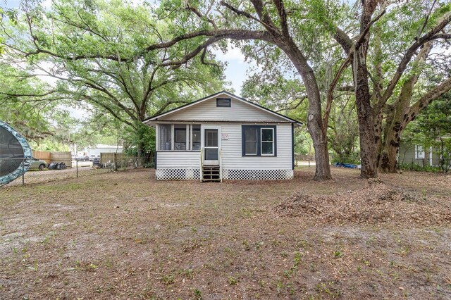view of front of house with fence and entry steps