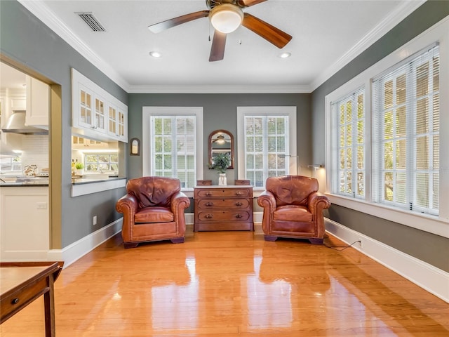 811 Laurel Ave, Orlando, FL 32803 - sitting room featuring light wood finished floors, recessed lighting, a ceiling fan, baseboards, and ornamental molding