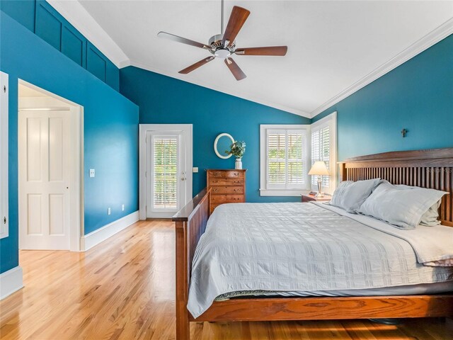 811 Laurel Ave, Orlando, FL 32803 - bedroom featuring lofted ceiling, ornamental molding, multiple windows, light wood-style floors, and access to exterior