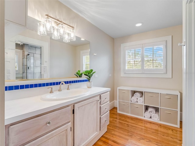 811 Laurel Ave, Orlando, FL 32803 - bathroom featuring wood finished floors, vanity, baseboards, and recessed lighting
