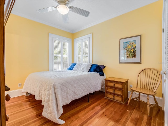 811 Laurel Ave, Orlando, FL 32803 - bedroom featuring wood finished floors, ornamental molding, baseboards, and ceiling fan