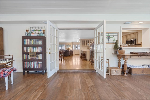 3015 Dawley Ave, Orlando, FL 32806 - foyer entrance with french doors, wood finished floors, and crown molding