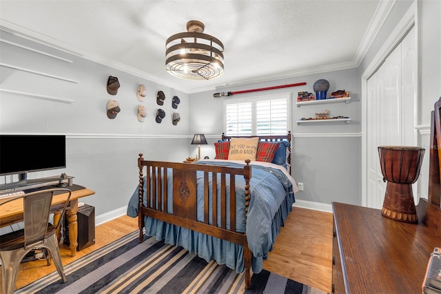 3015 Dawley Ave, Orlando, FL 32806 - bedroom featuring wood finished floors and ornamental molding