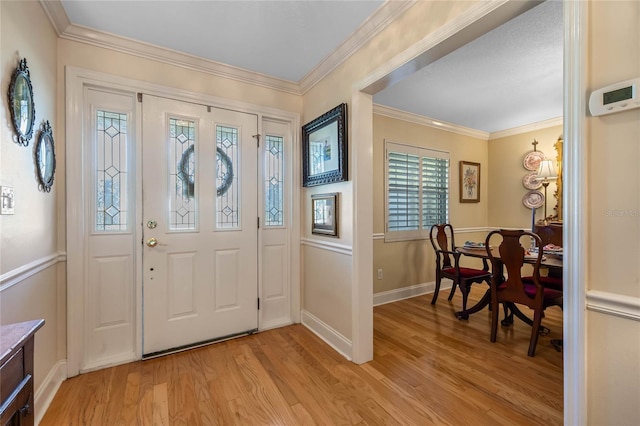 3015 Dawley Ave, Orlando, FL 32806 - entryway with light wood-style flooring and ornamental molding