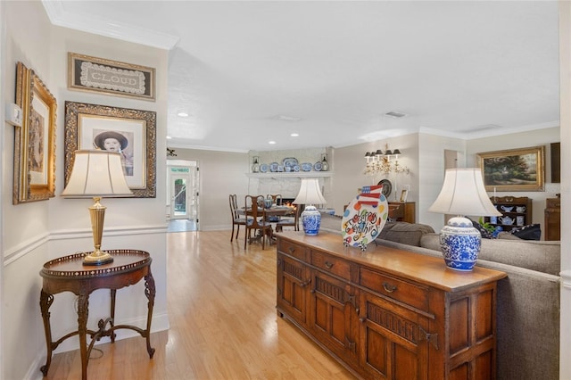 3015 Dawley Ave, Orlando, FL 32806 - living room with light wood-style flooring, ornamental molding, and recessed lighting
