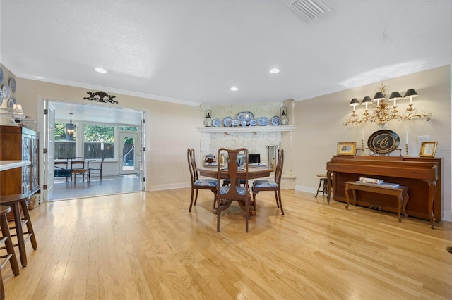 3015 Dawley Ave, Orlando, FL 32806 - dining area with crown molding, light wood-type flooring, recessed lighting, and a chandelier