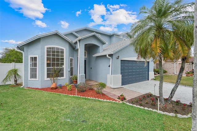 1517 Abberton Dr, Orlando, FL 32837 - single story home featuring a front yard, a garage, fence, stucco siding, and driveway