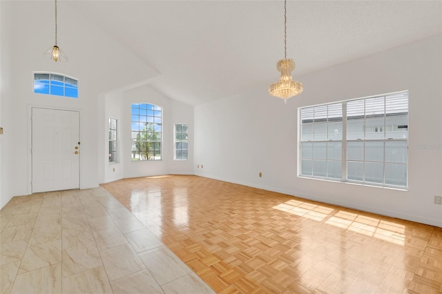 1517 Abberton Dr, Orlando, FL 32837 - entrance foyer featuring high vaulted ceiling, an inviting chandelier, and baseboards