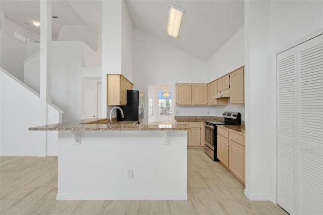1517 Abberton Dr, Orlando, FL 32837 - kitchen featuring electric stove, a breakfast bar, light stone counters, a peninsula, and fridge