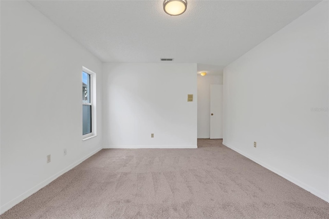 1517 Abberton Dr, Orlando, FL 32837 - unfurnished room featuring visible vents, baseboards, carpet, and a textured ceiling