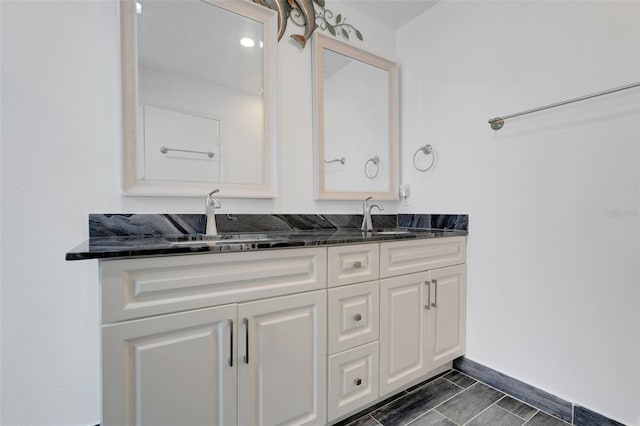 1517 Abberton Dr, Orlando, FL 32837 - full bathroom with double vanity, a sink, and baseboards