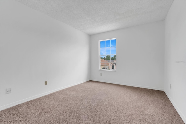 1517 Abberton Dr, Orlando, FL 32837 - spare room with carpet flooring, a textured ceiling, and baseboards