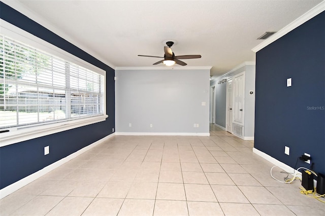 unfurnished room featuring crown molding, visible vents, ceiling fan, and light tile patterned floors