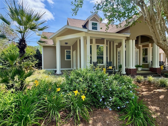 6037 Lake Erie Rd, Groveland, FL 34736 - view of front of home with a porch and roof with shingles