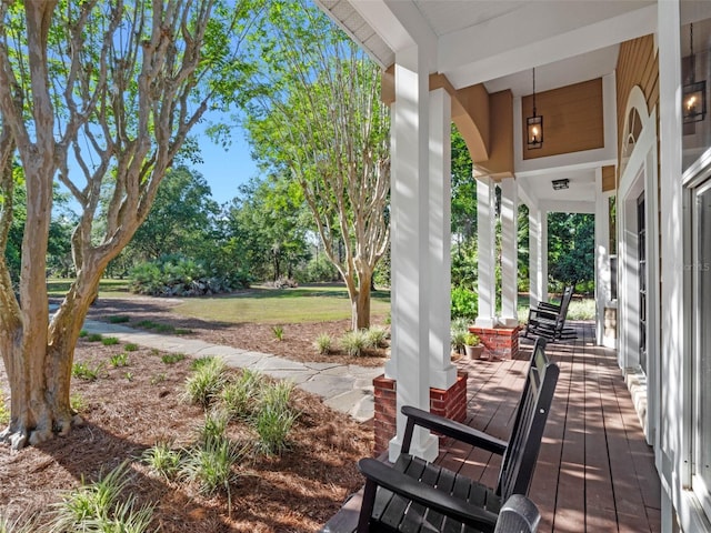 6037 Lake Erie Rd, Groveland, FL 34736 - view of patio with a porch