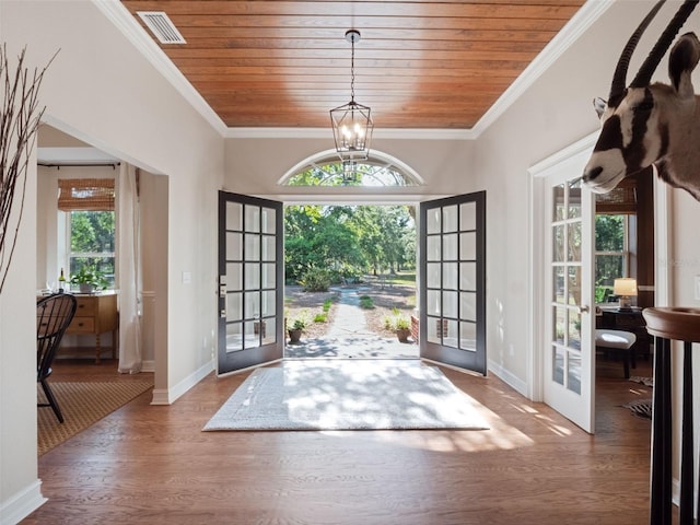 6037 Lake Erie Rd, Groveland, FL 34736 - foyer entrance with french doors, wooden ceiling, wood finished floors, baseboards, and a chandelier