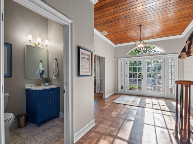 6037 Lake Erie Rd, Groveland, FL 34736 - interior space with wooden ceiling, ornamental molding, baseboards, a chandelier, and a sink