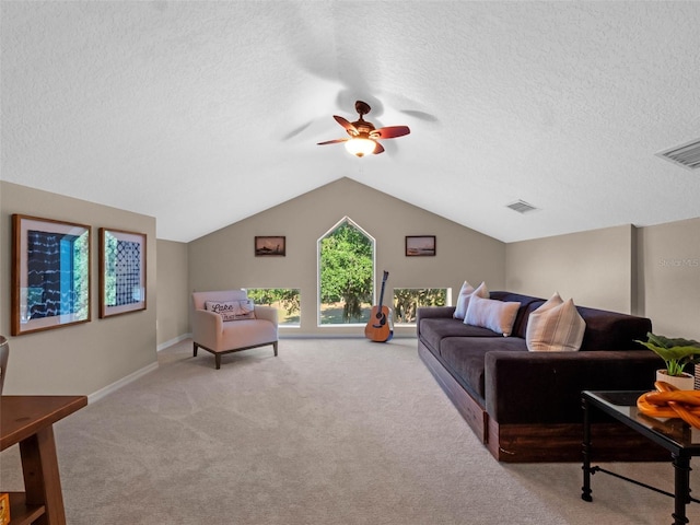 6037 Lake Erie Rd, Groveland, FL 34736 - living room with a textured ceiling, light carpet, ceiling fan, lofted ceiling, and baseboards