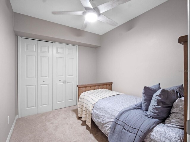 6037 Lake Erie Rd, Groveland, FL 34736 - carpeted bedroom featuring a closet and a ceiling fan