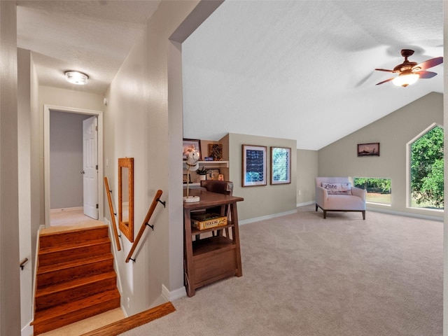 6037 Lake Erie Rd, Groveland, FL 34736 - interior space featuring vaulted ceiling, carpet, a textured ceiling, a ceiling fan, and baseboards