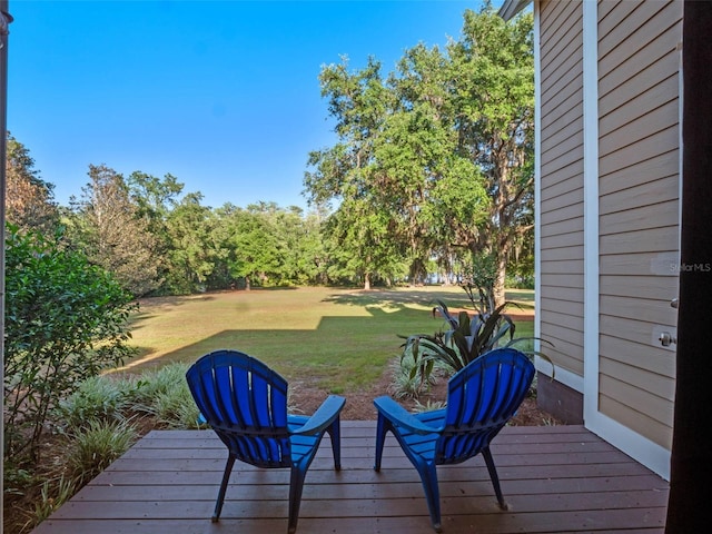 6037 Lake Erie Rd, Groveland, FL 34736 - wooden deck with a yard
