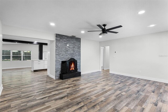 505 Lake Shore Dr, Maitland, FL 32751 - unfurnished living room with a ceiling fan, wood finished floors, a fireplace, and recessed lighting