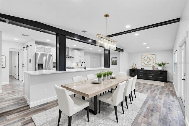 505 Lake Shore Dr, Maitland, FL 32751 - dining room with recessed lighting, light wood-type flooring, baseboards, and a barn door