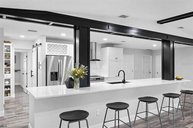 505 Lake Shore Dr, Maitland, FL 32751 - kitchen with light wood-style flooring, a sink, baseboards, white cabinetry, and appliances with stainless steel finishes