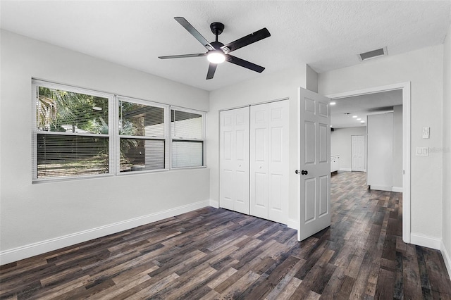 505 Lake Shore Dr, Maitland, FL 32751 - unfurnished bedroom featuring a closet, ceiling fan, baseboards, dark wood-style flooring, and visible vents